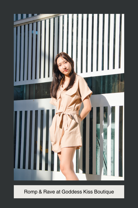 This is an image of a person wearing a beige Romper for a Blog post by Goddess Kiss Boutique's Rompers Collection. 