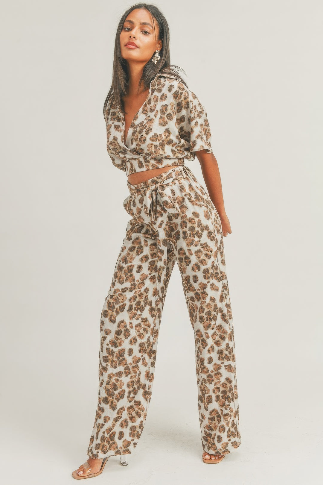 a person in a leopard print jumpsuit