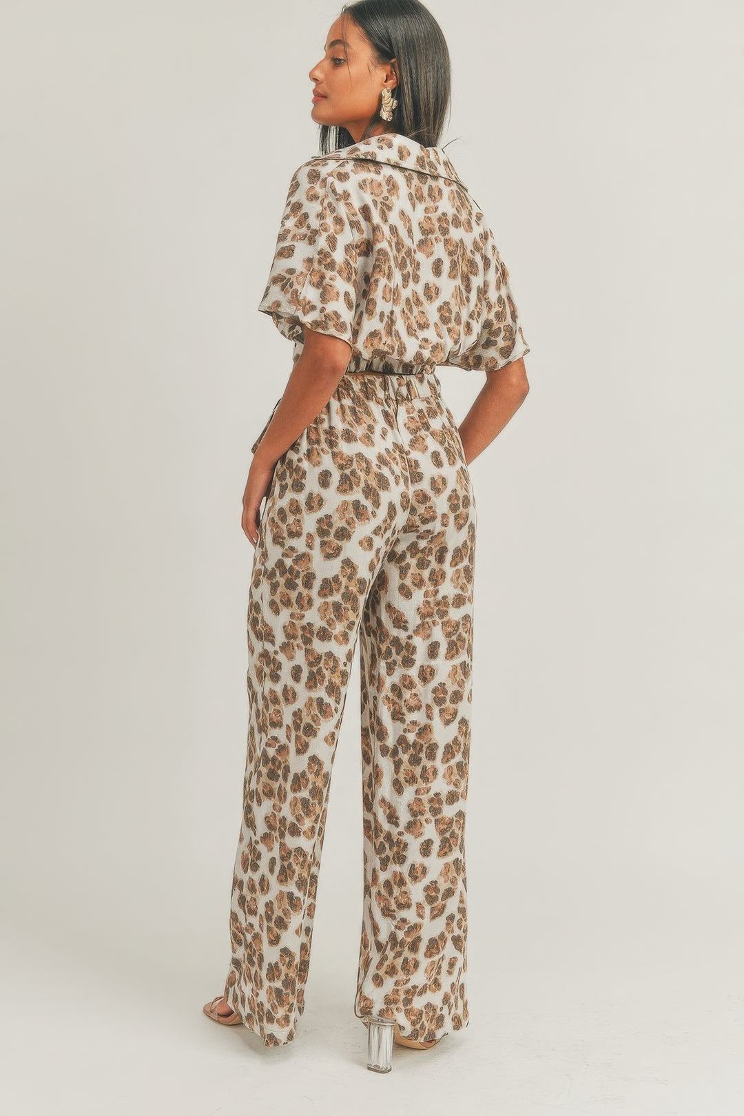a person wearing a leopard print jumpsuit