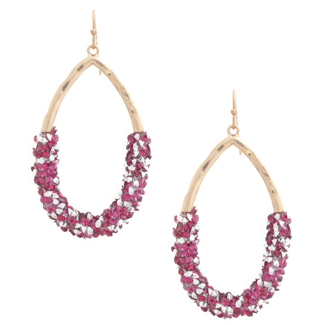 a pair of pink and white beaded hoop earrings