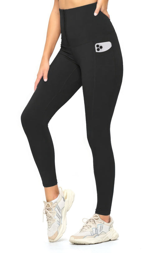 a woman wearing black leggings with a pocket on the side