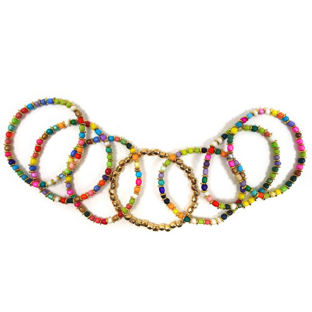 a group of multicolored bracelets on a white background