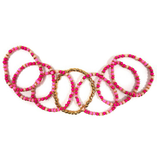 a necklace with pink beads on a white background