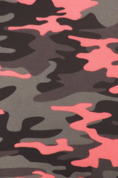 a close up of a pink and black camo pattern on leggings