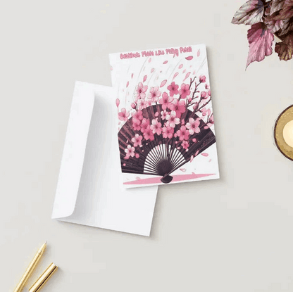 Illustration of an anime thank you card featuring cherry blossom petals drifting onto an elegant open fan, symbolizing gratitude and appreciation with soft, ethereal beauty.