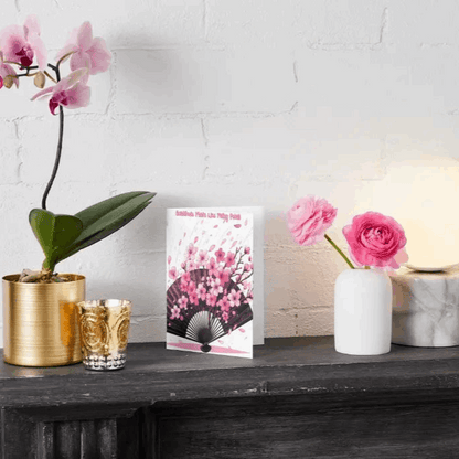 Illustration of an anime thank you card featuring cherry blossom petals drifting onto an elegant open fan, symbolizing gratitude and appreciation with soft, ethereal beauty.