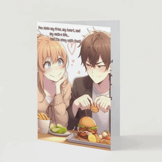 Illustration of an anime-style couple, with the male character happily eating while the female character lovingly stares in mild annoyance as her food gets stolen. The caption reads, "You stole my fries, my heart, and my entire life… and I’m okay with that.