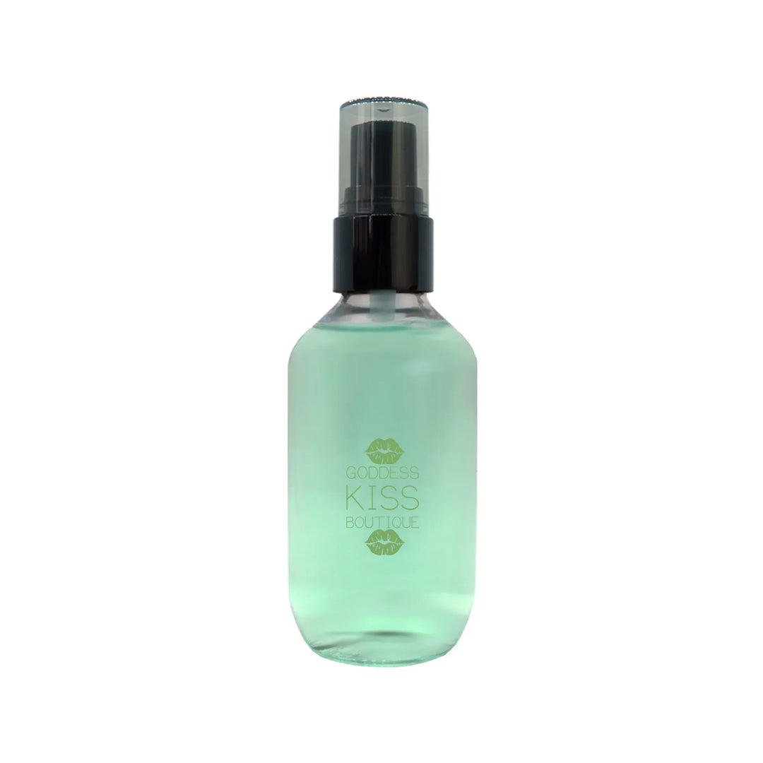 a bottle of green liquid on a white background