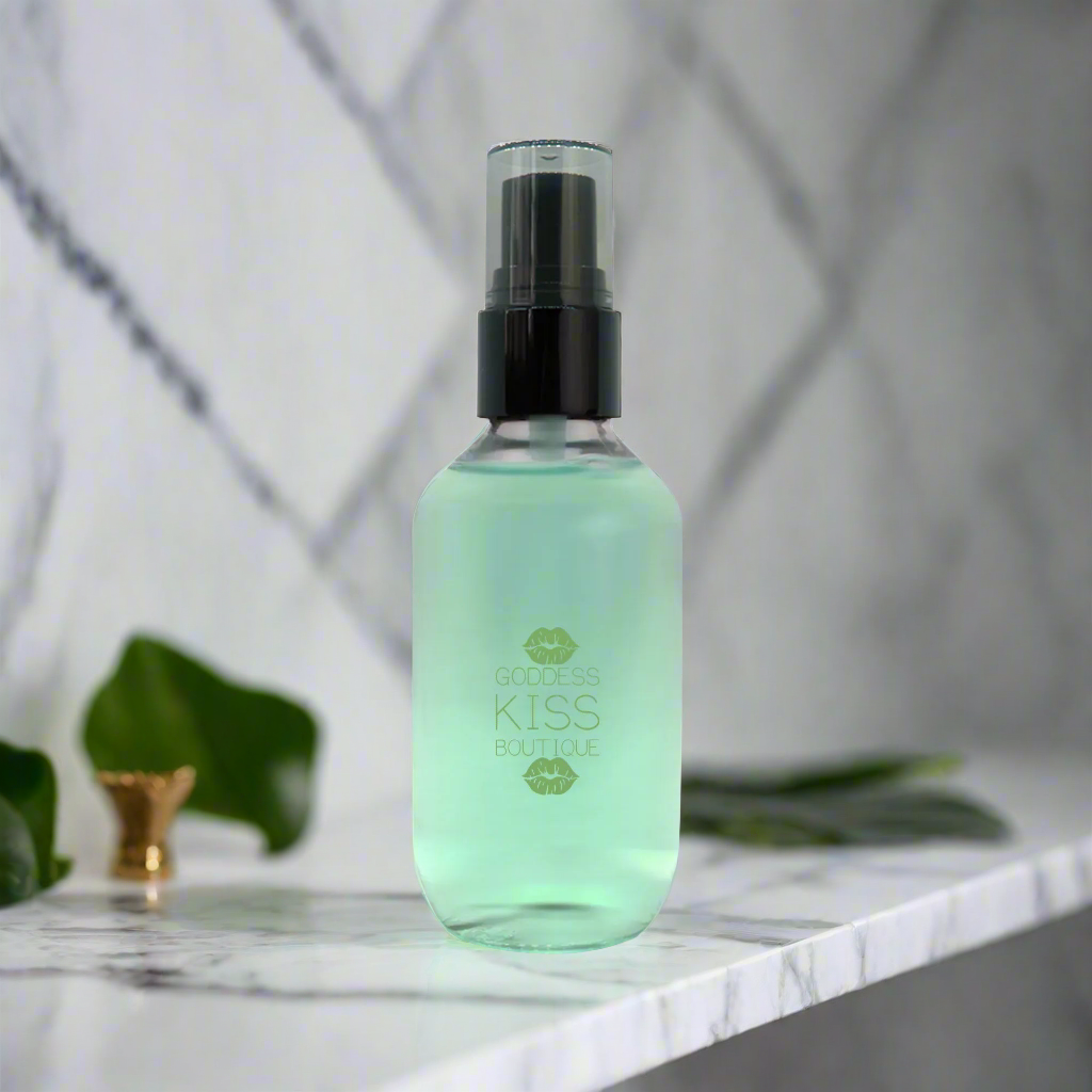 a bottle of green liquid sitting on top of a counter